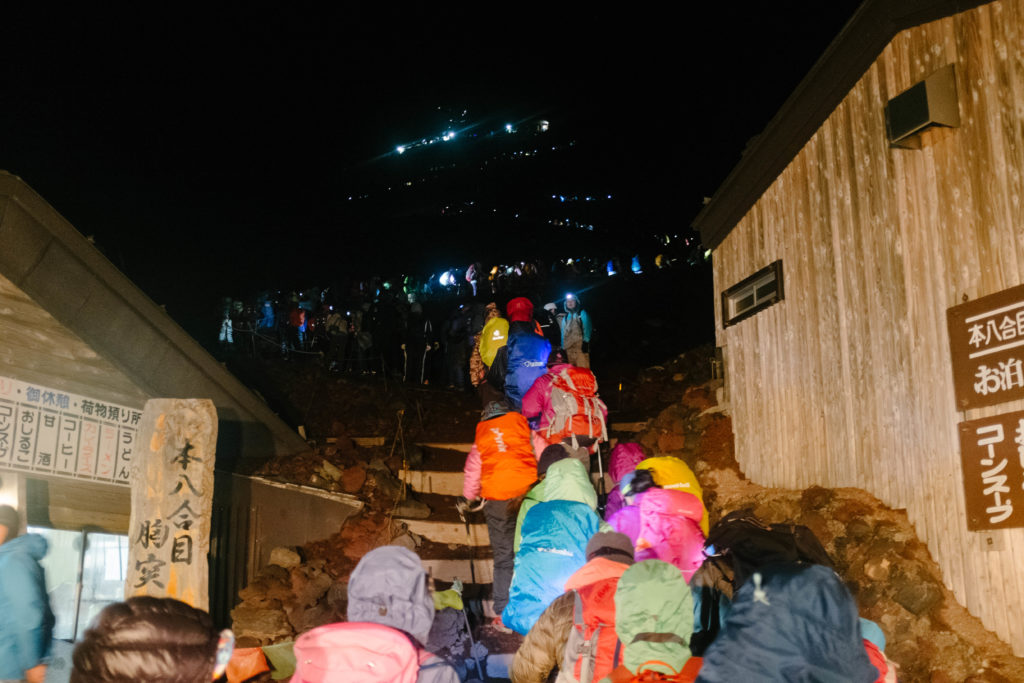 Hikers queue to summit Mt. Fuji.