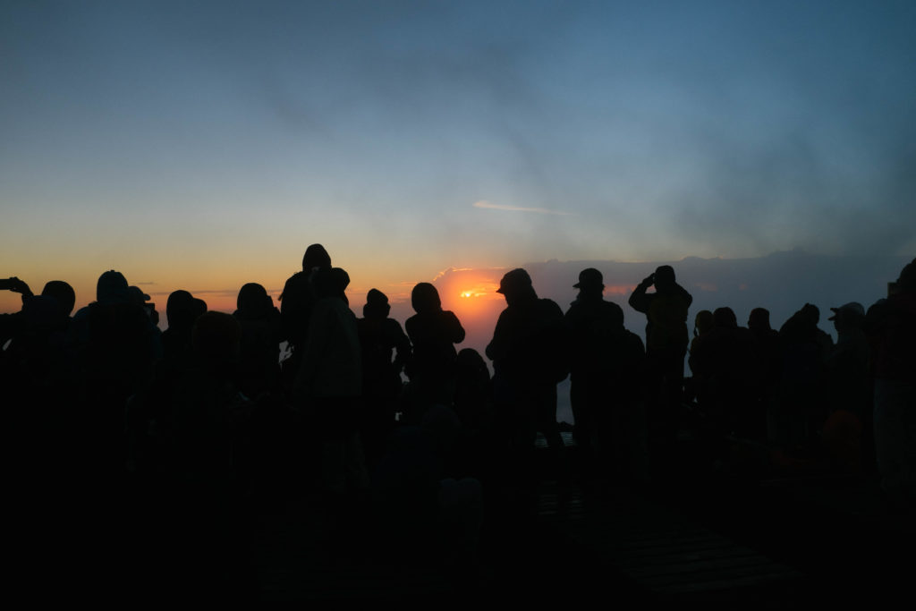 Awaiting the sunrise atop Mt. Fuji.