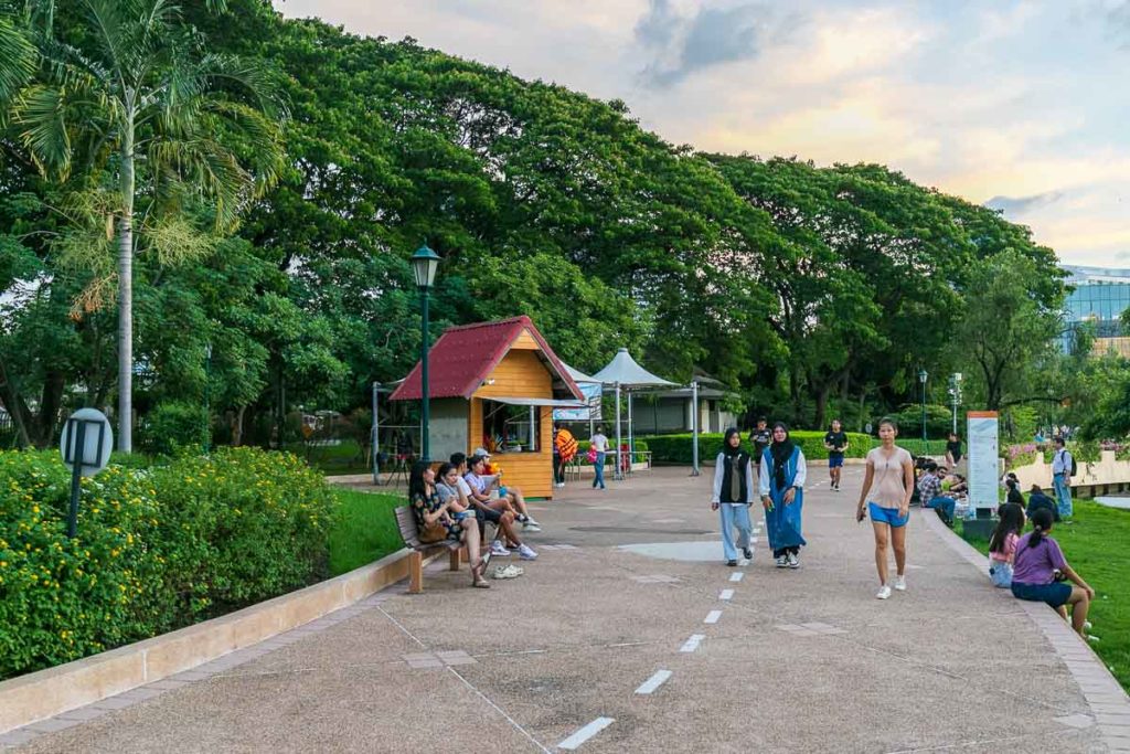 People walking in Benjakitti Park.